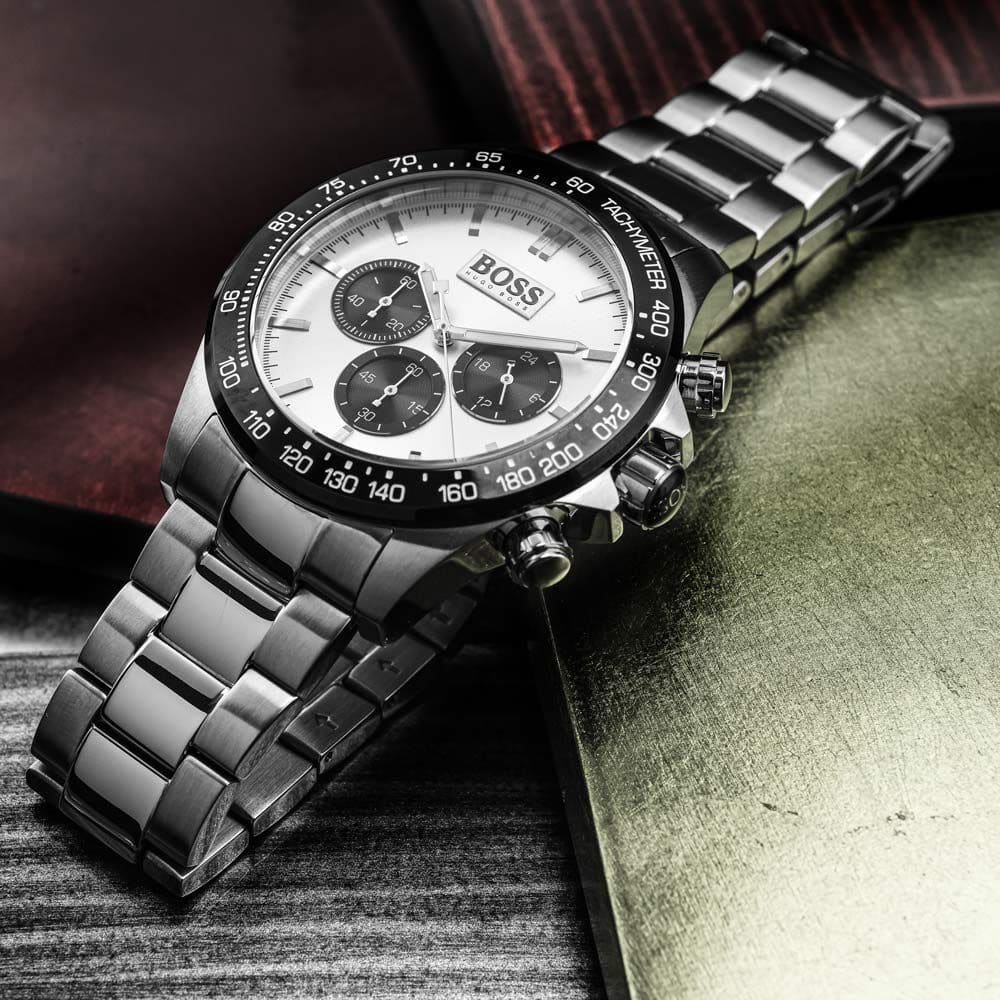 Hugo Boss Ikon chronograph watch styled with fabric backdrop showing silver finish