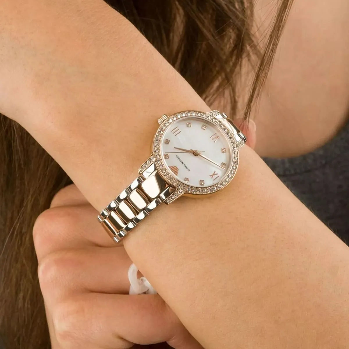 Emporio Armani Cleo watch worn on wrist showing white dial and crystal bezel