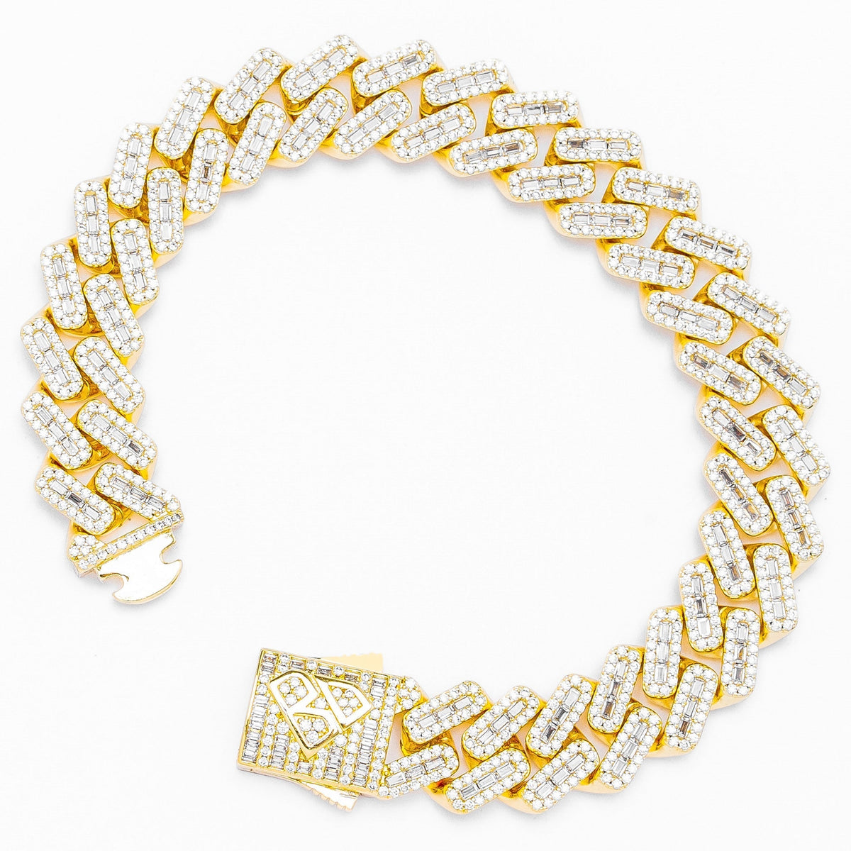 Gold Cuban chain bracelet with pave set baguette diamonds and rhombus clasp detail