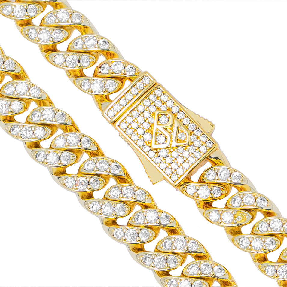 Close-up of Cuban link chain and gold box clasp with crystal details