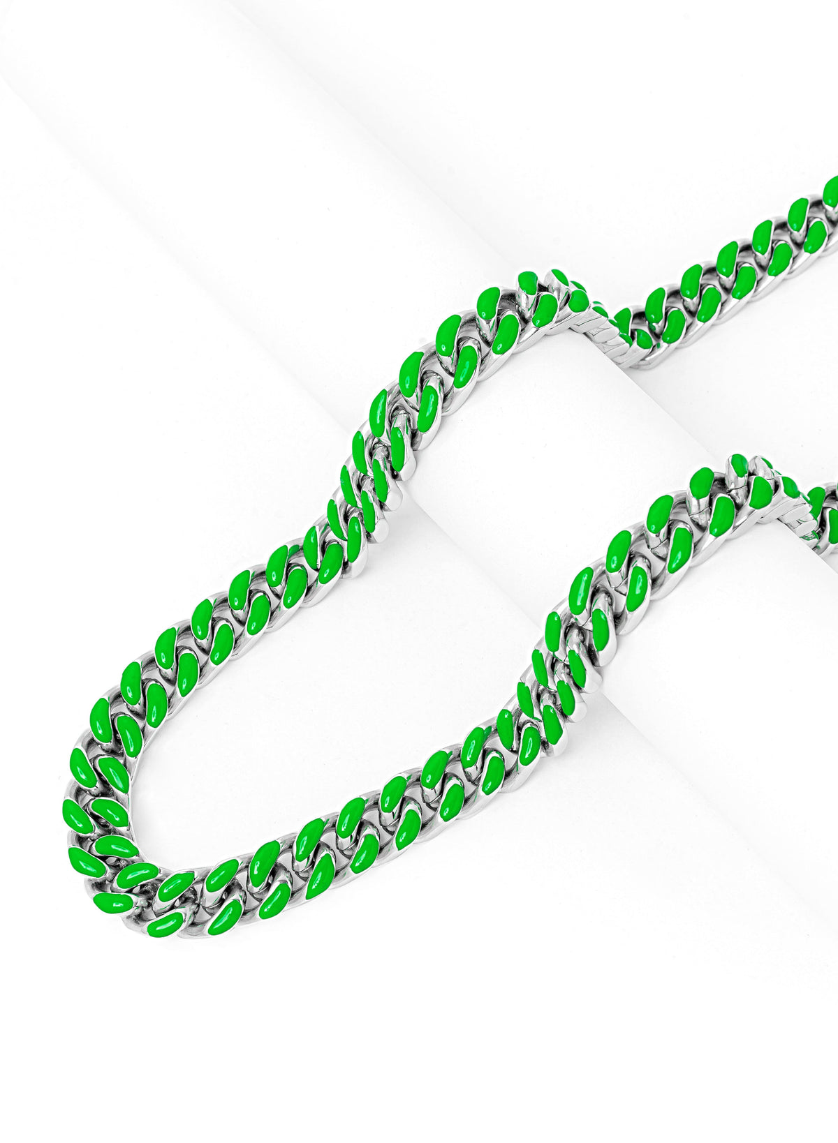 Full length view of green and silver Cuban link chain with layered display