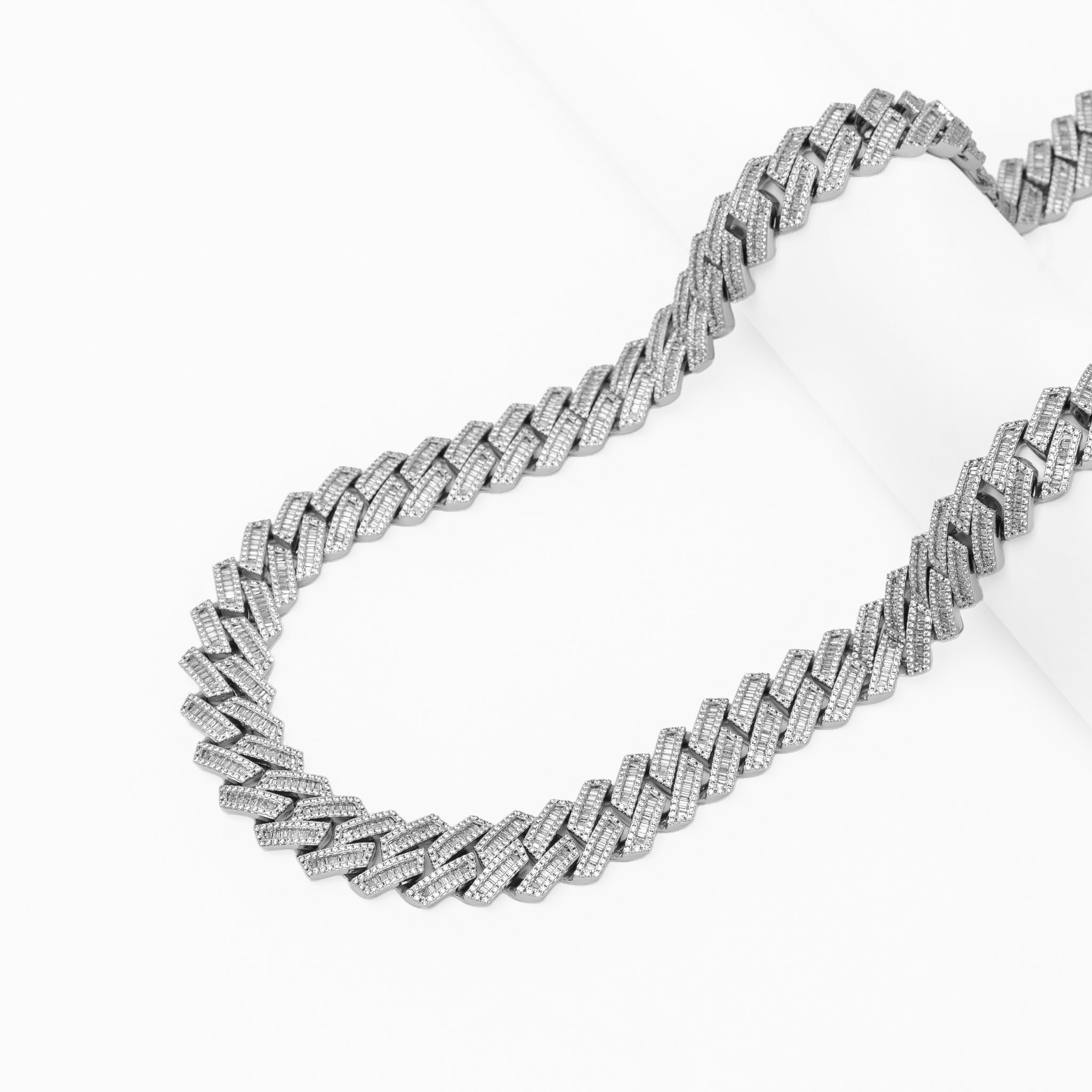 Big Daddy 16MM baguette Cuban link chain draped lay flat showing texture and sparkle