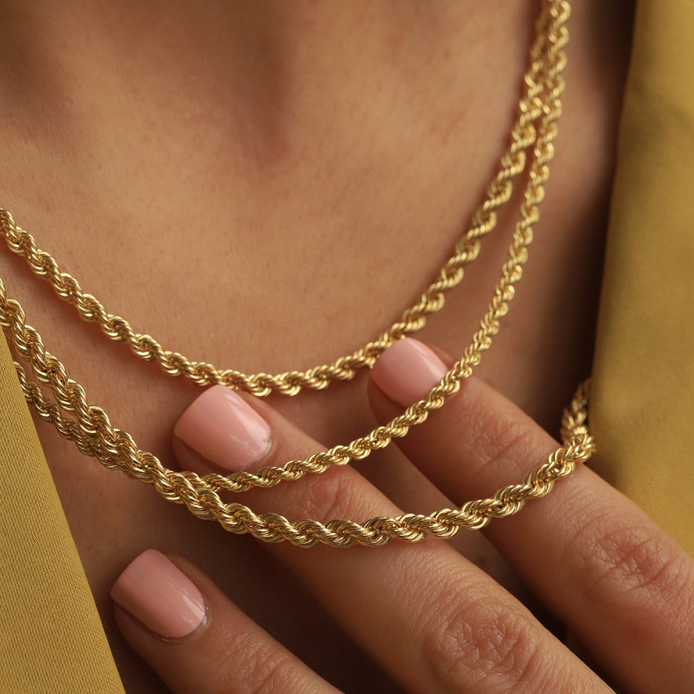 Layered Big Daddy gold rope chains worn together showing chain detail