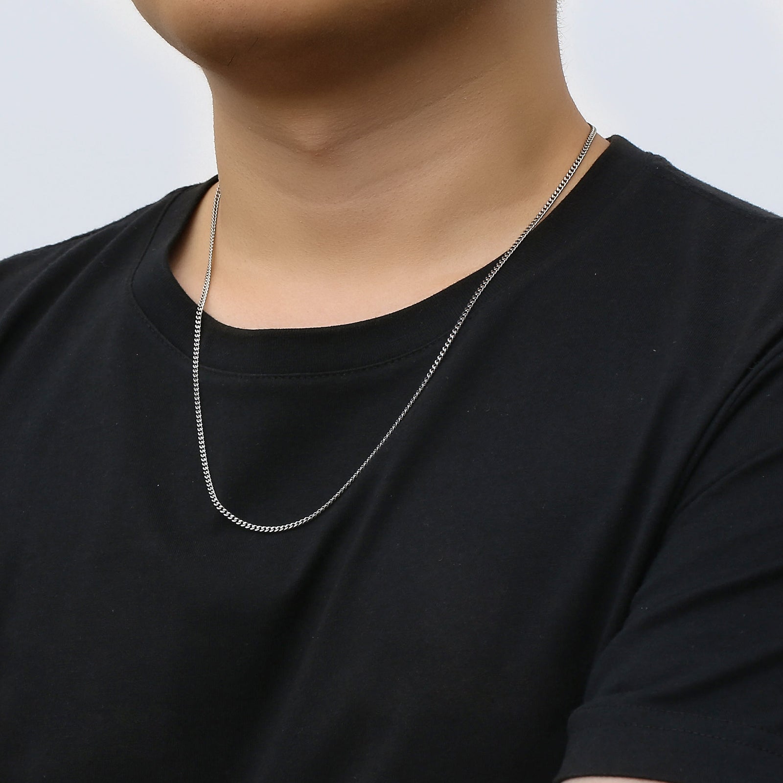 Big Daddy 2mm Cuban silver chain worn on neck, showing chain drape and fit