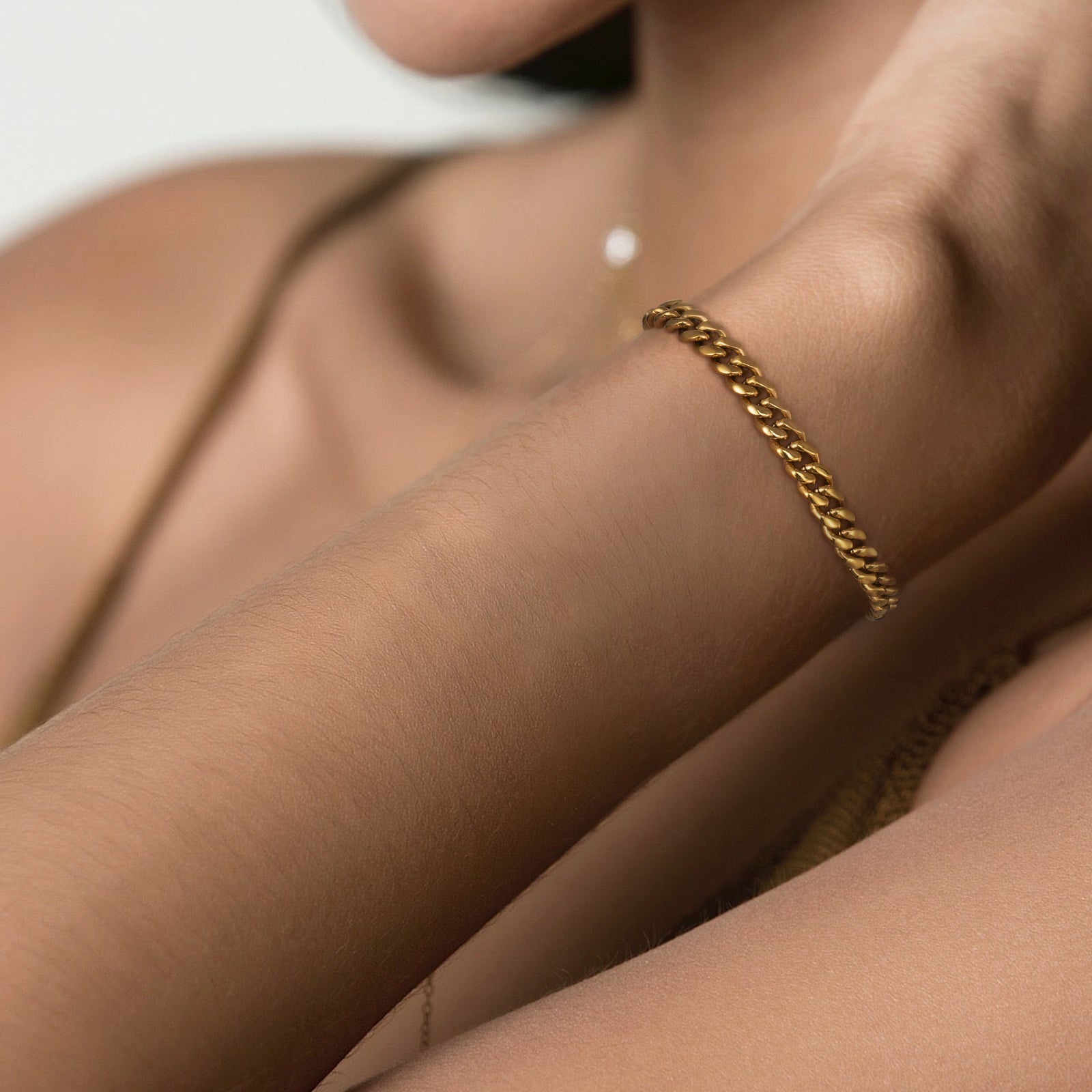 5mm Cuban link gold bracelet worn on wrist, showcasing chain detail