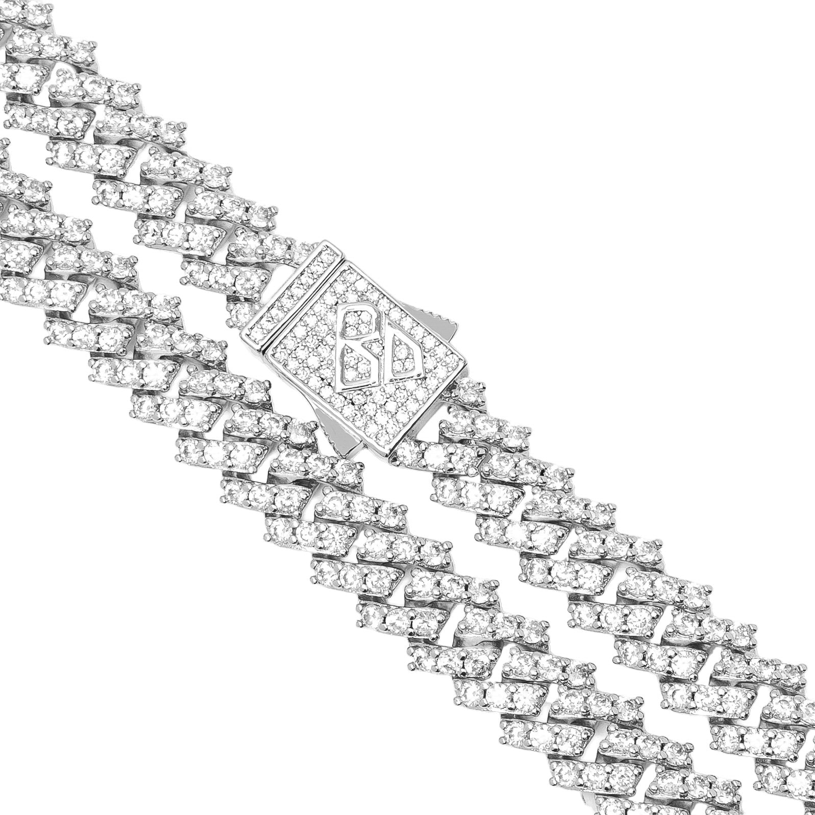 Close-up detail of diamond prong settings and silver clasp on Cuban link chain
