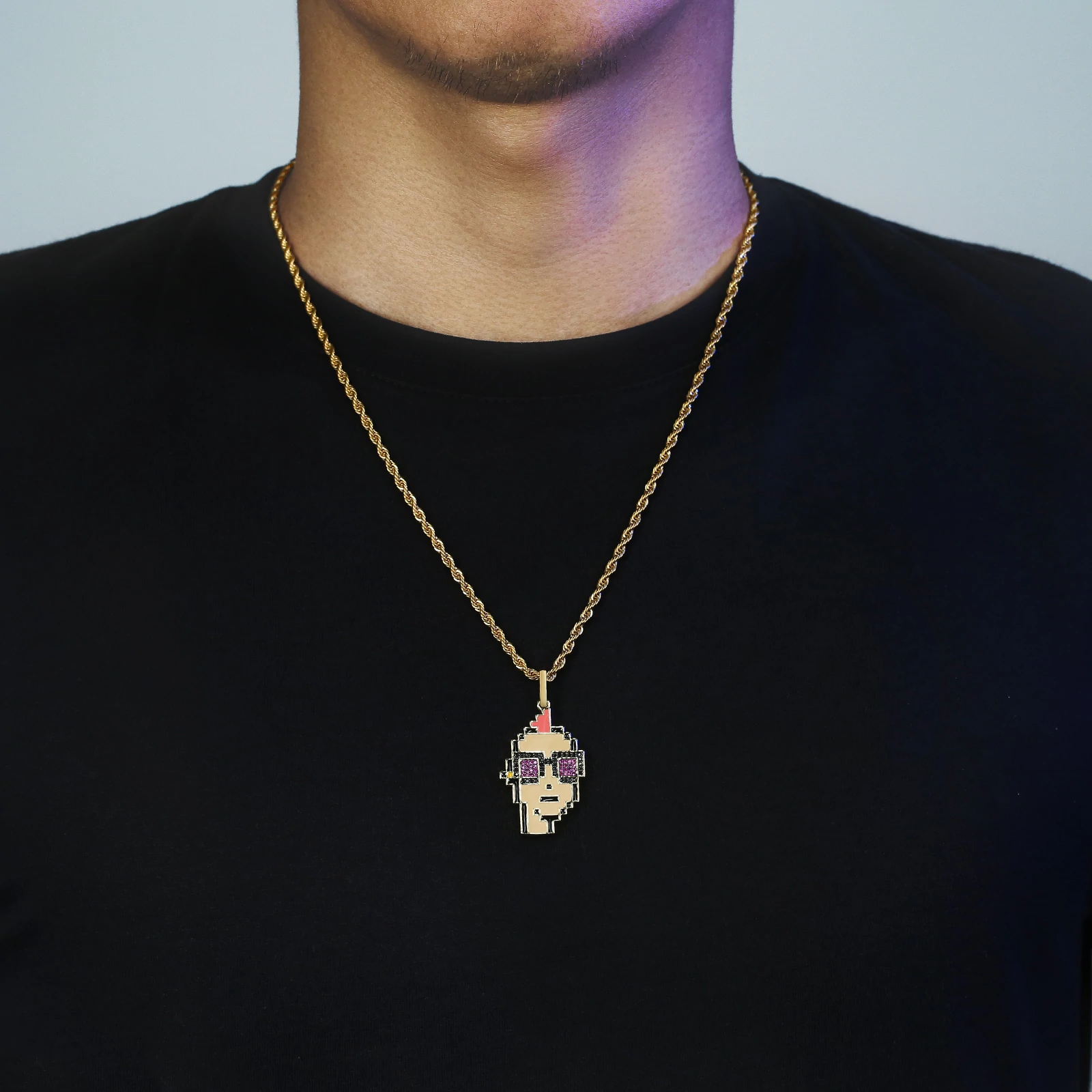 Iced-out Big Daddy Cryptopunk pendant worn on gold chain around model's neck