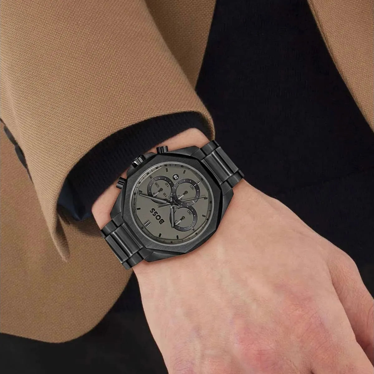 BOSS 1514016 chronograph watch worn on wrist with grey dial and black steel bracelet