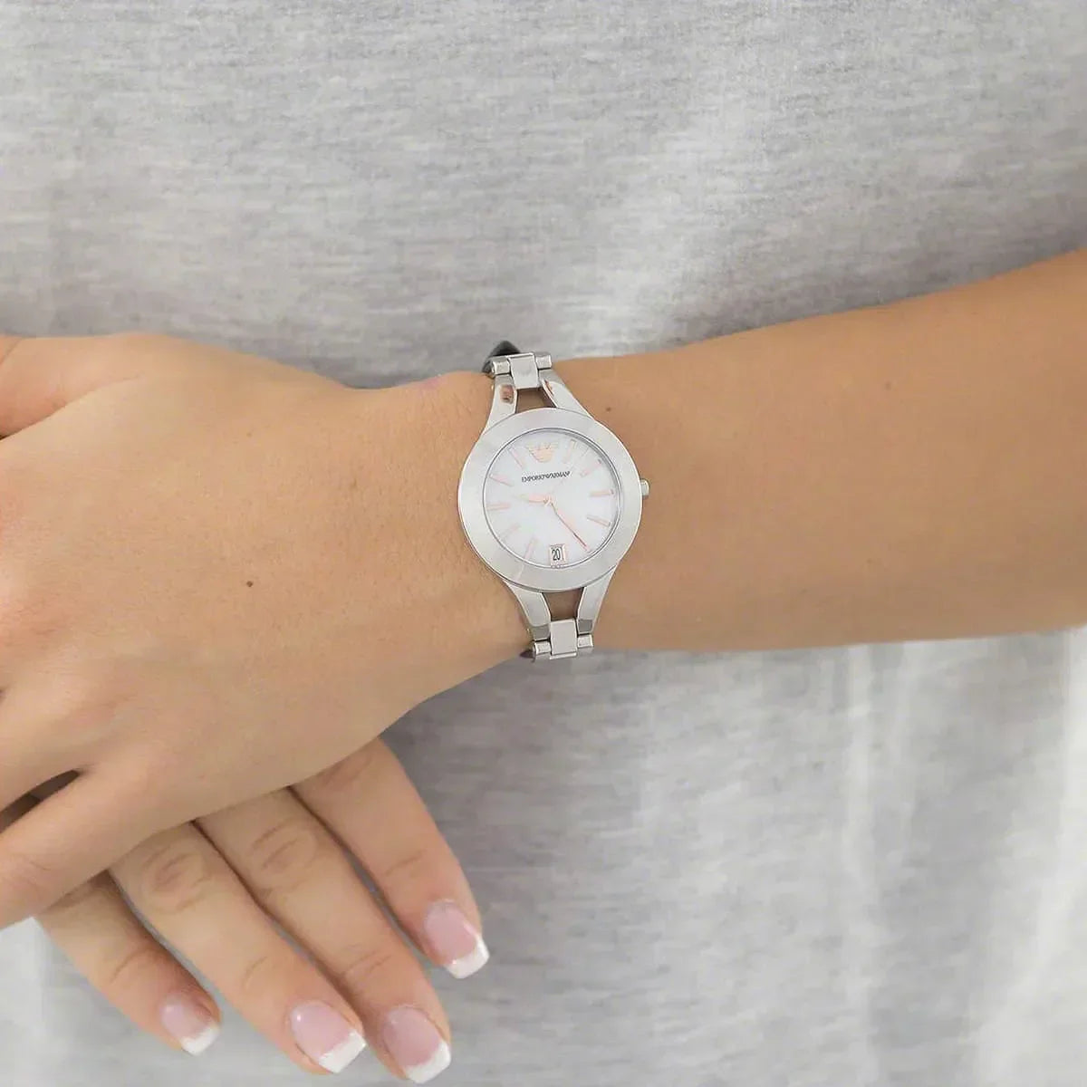 Emporio Armani Chiara AR7429 silver watch worn on wrist with black leather strap