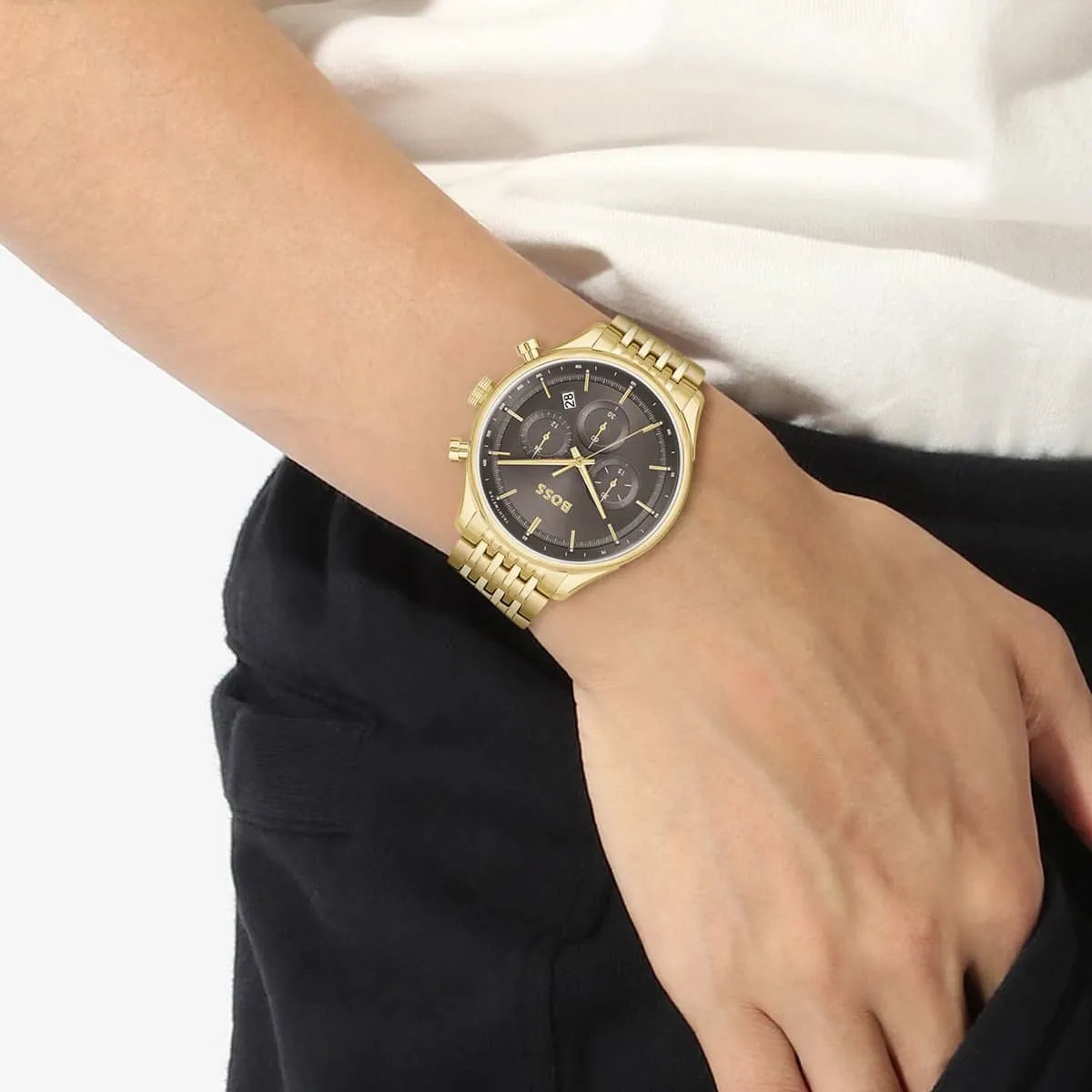 Hugo Boss Gregor chronograph watch on wrist detail view showing dial and gold strap