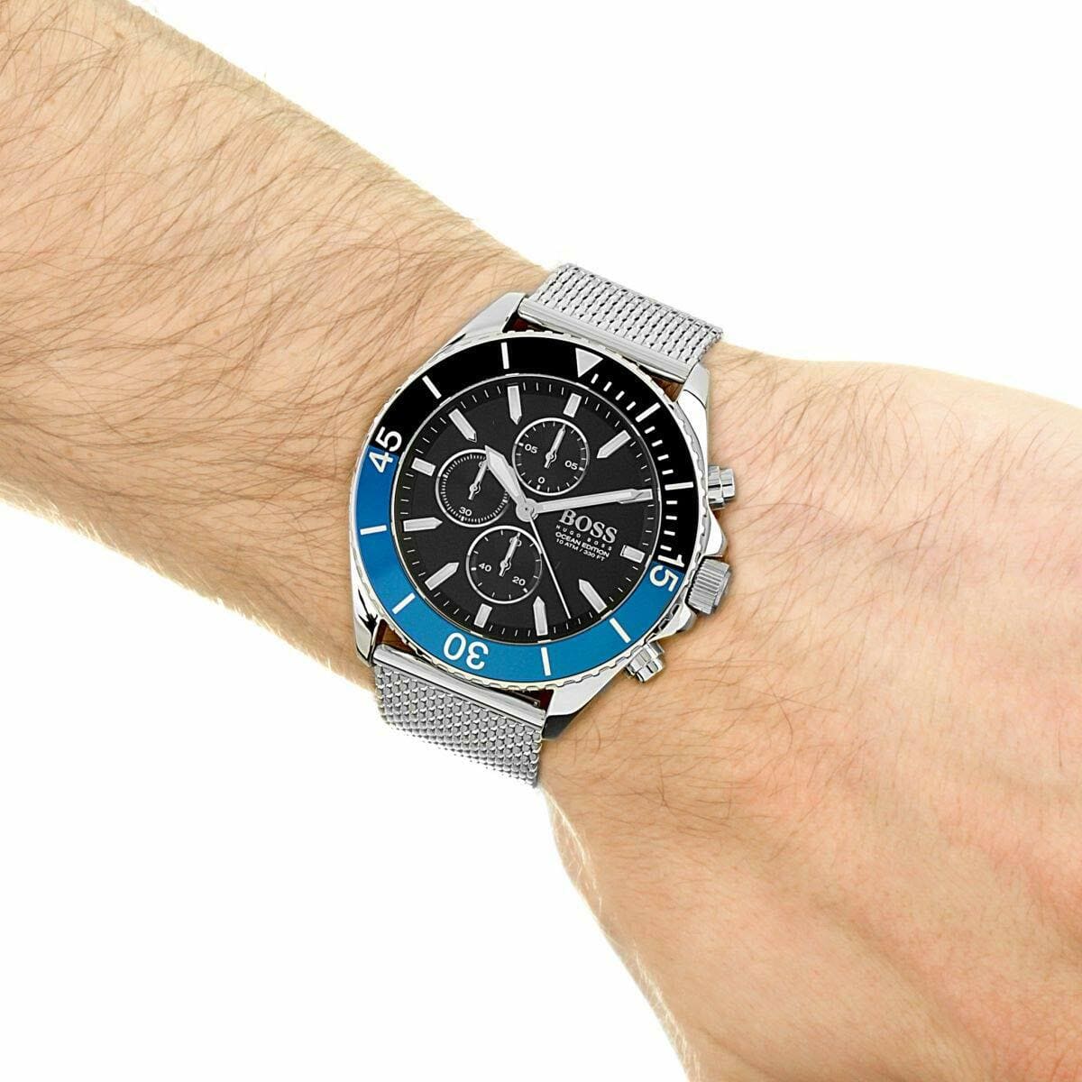 Hugo Boss Ocean Edition chronograph worn on male wrist with silver mesh strap
