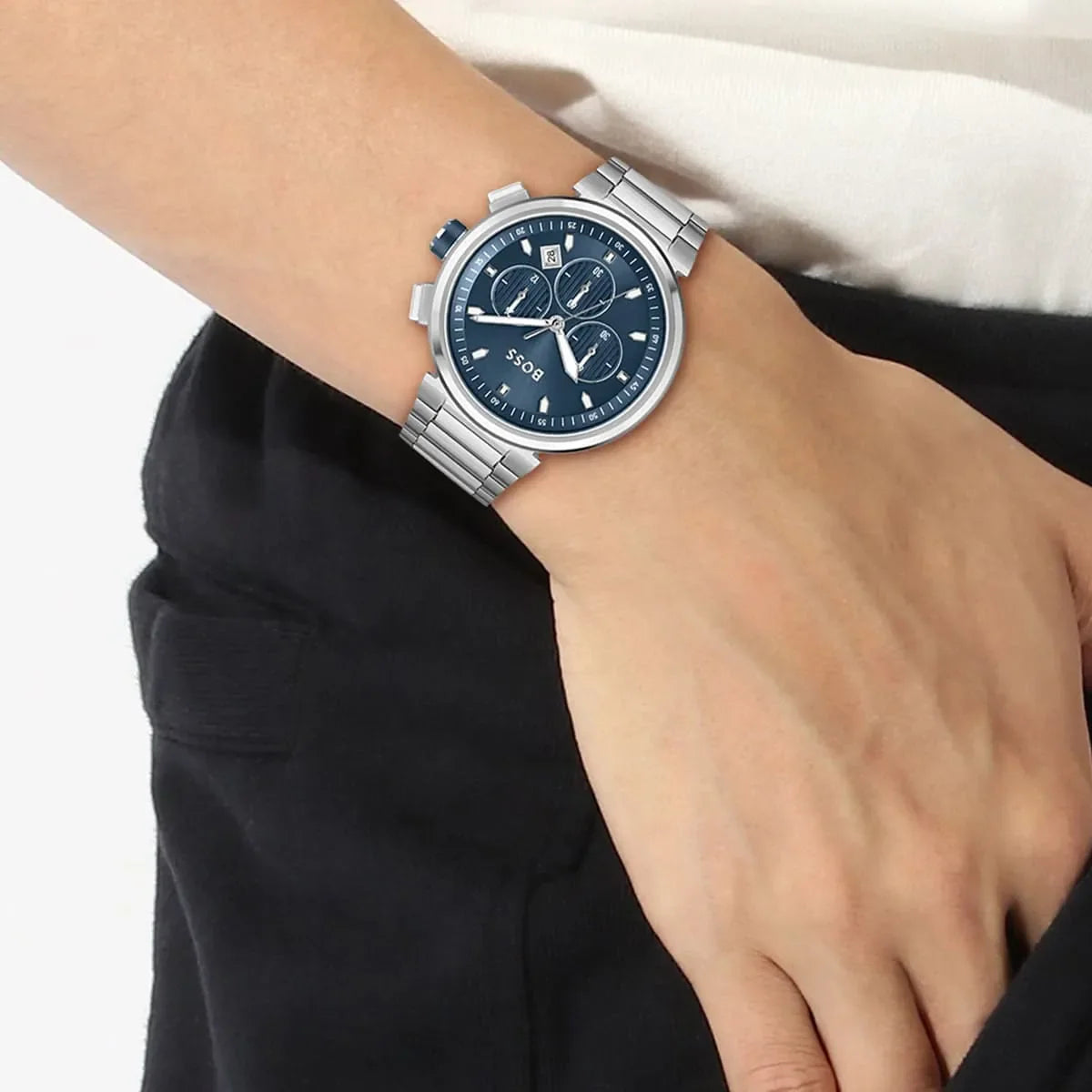 Hugo Boss One chronograph watch on wrist with navy dial and stainless steel strap