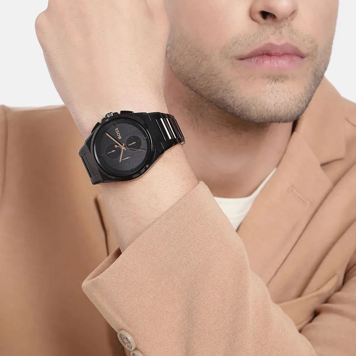 Man wearing Hugo Boss Steer chronograph watch with black dial and bracelet