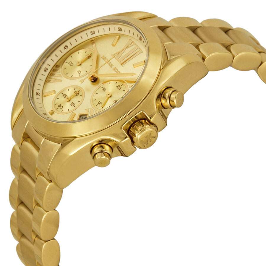Side angle view of Michael Kors Bradshaw gold chronograph with champagne dial and bracelet