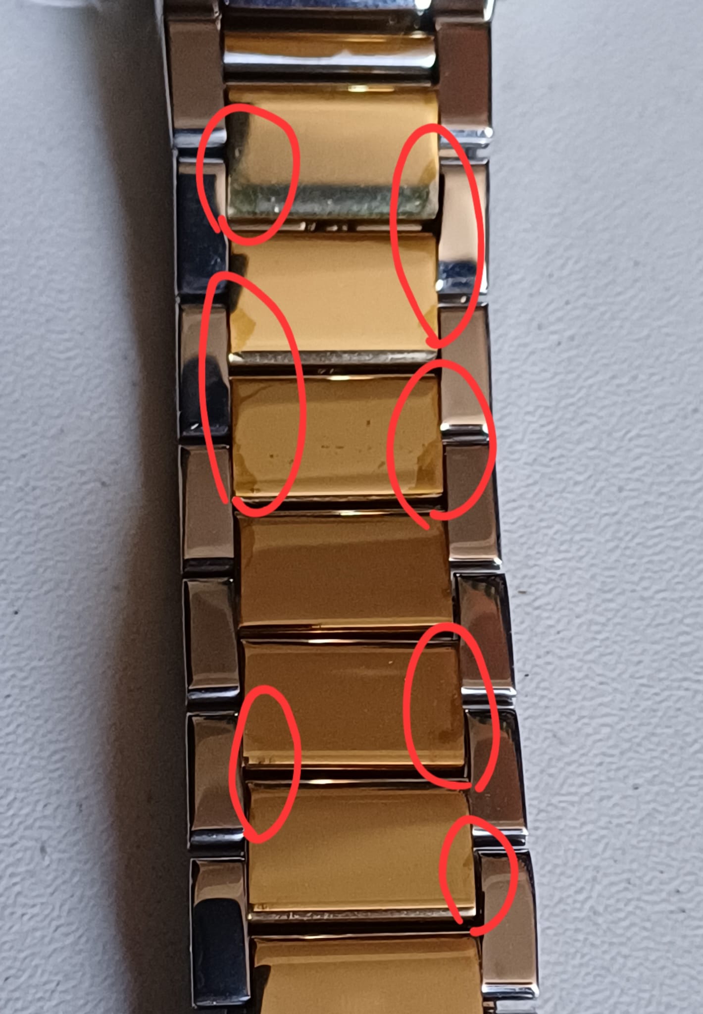 Detailed view of Parker chronograph watch two-tone bracelet links and construction