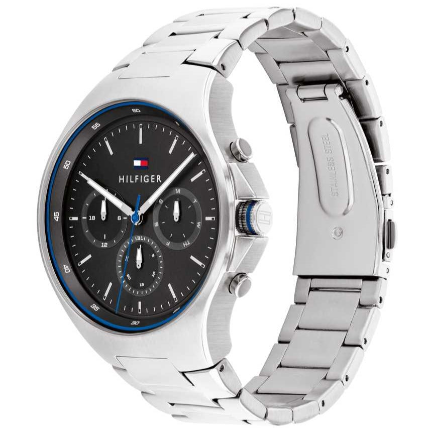 Tommy Hilfiger 1792054 three-quarter view showing silver bracelet and black dial with blue bezel