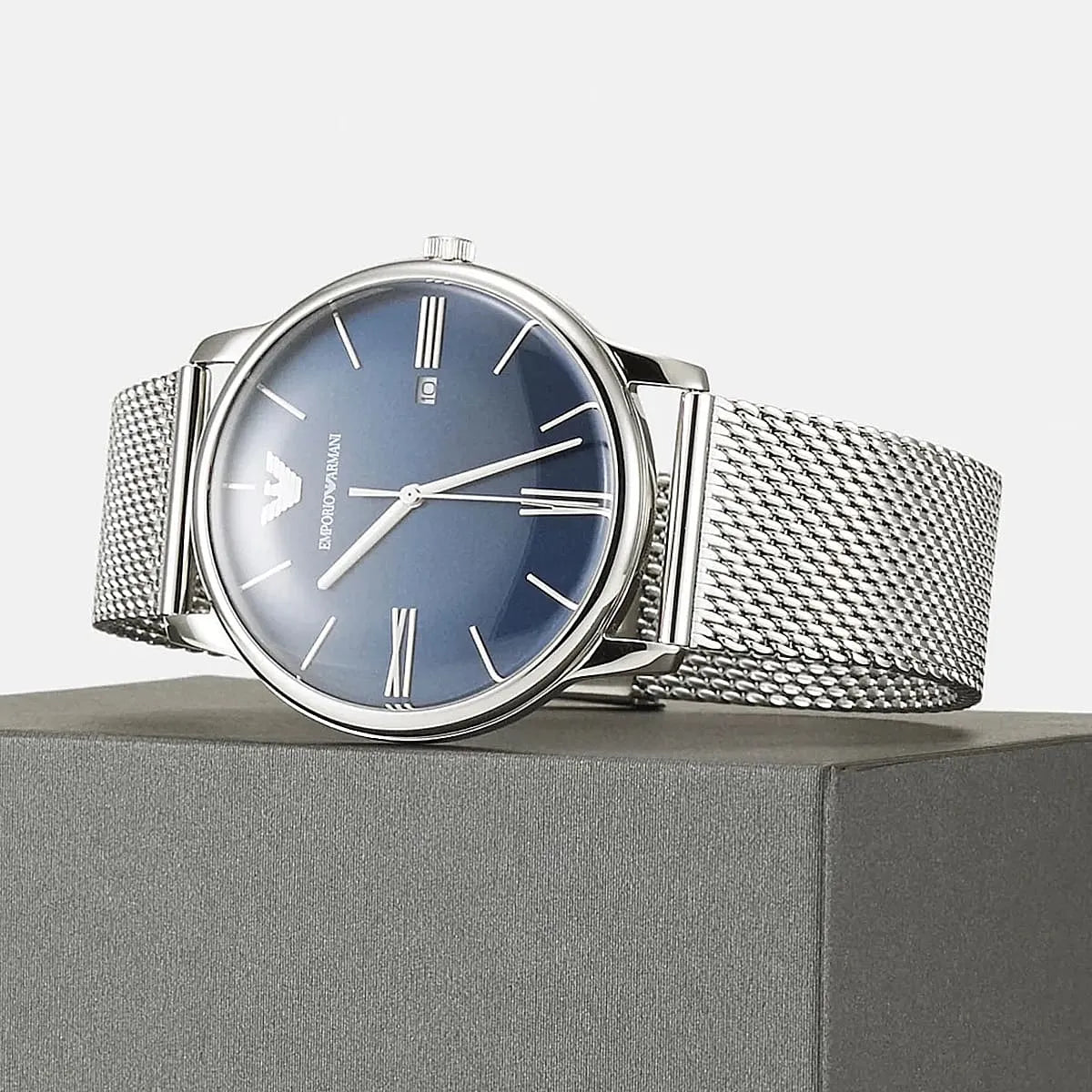 Emporio Armani AR11571 watch on wrist with blue dial and silver mesh bracelet