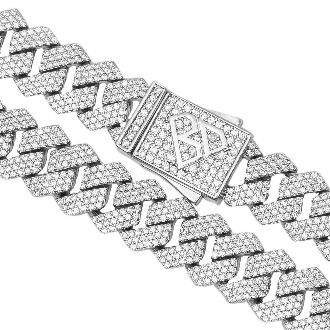 Angled view of 10MM Cuban chain showing diamond prongs and clasp detail