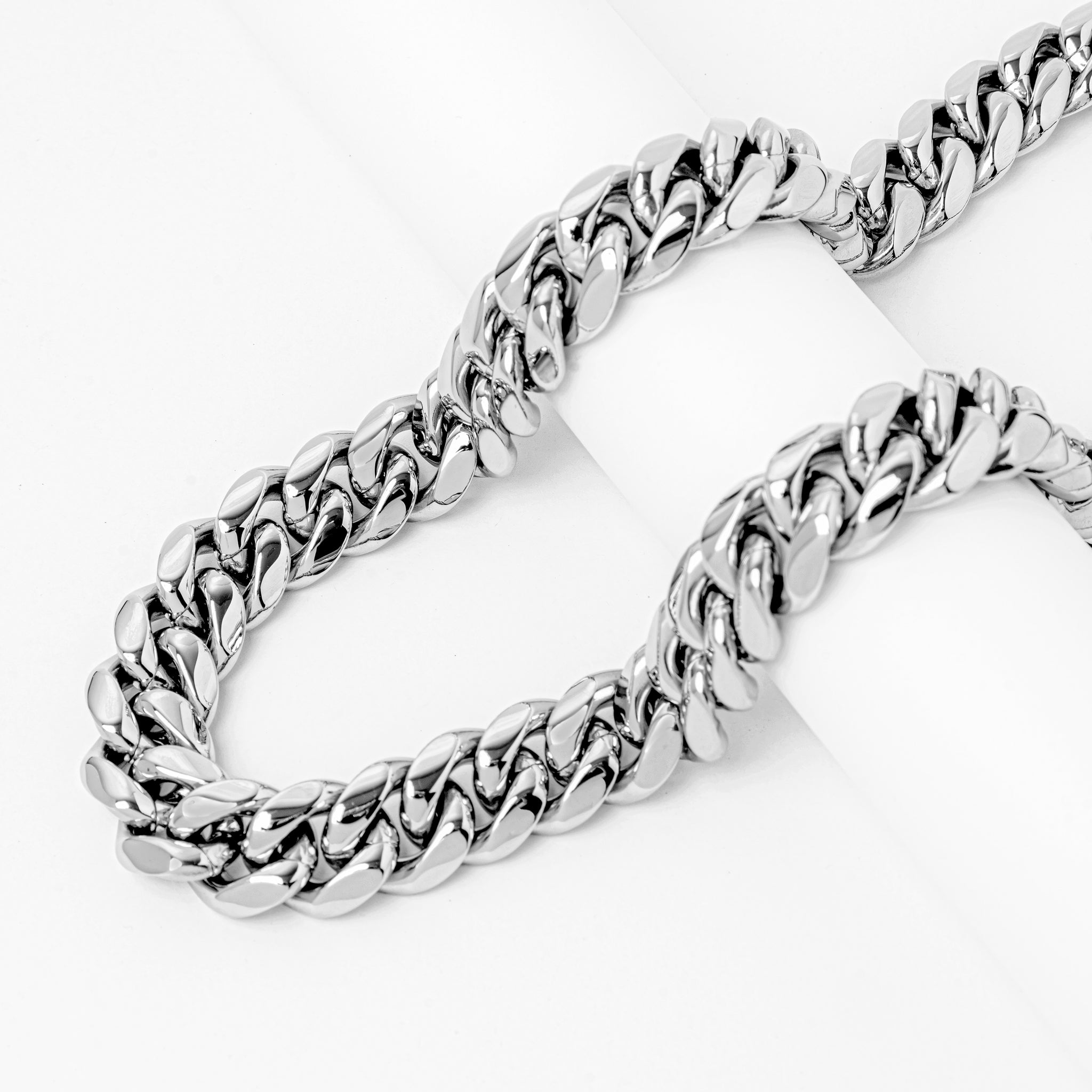 18MM stainless steel Cuban link chain displayed as curved strands