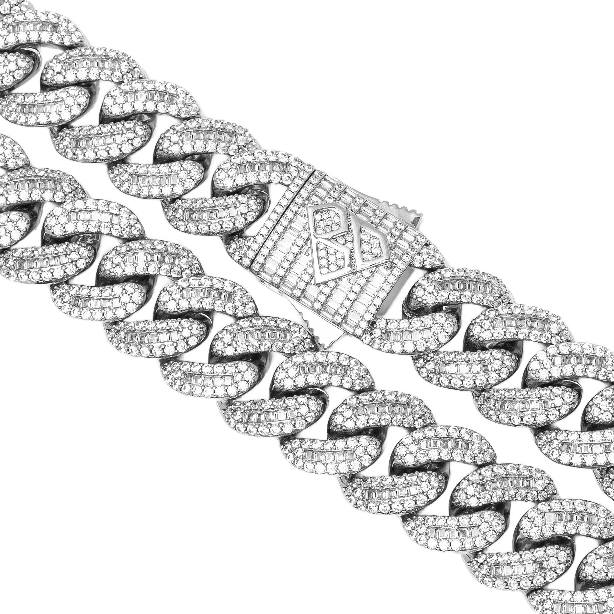 Close-up of baguette clasp and Cuban link chain details with diamond-cut stones