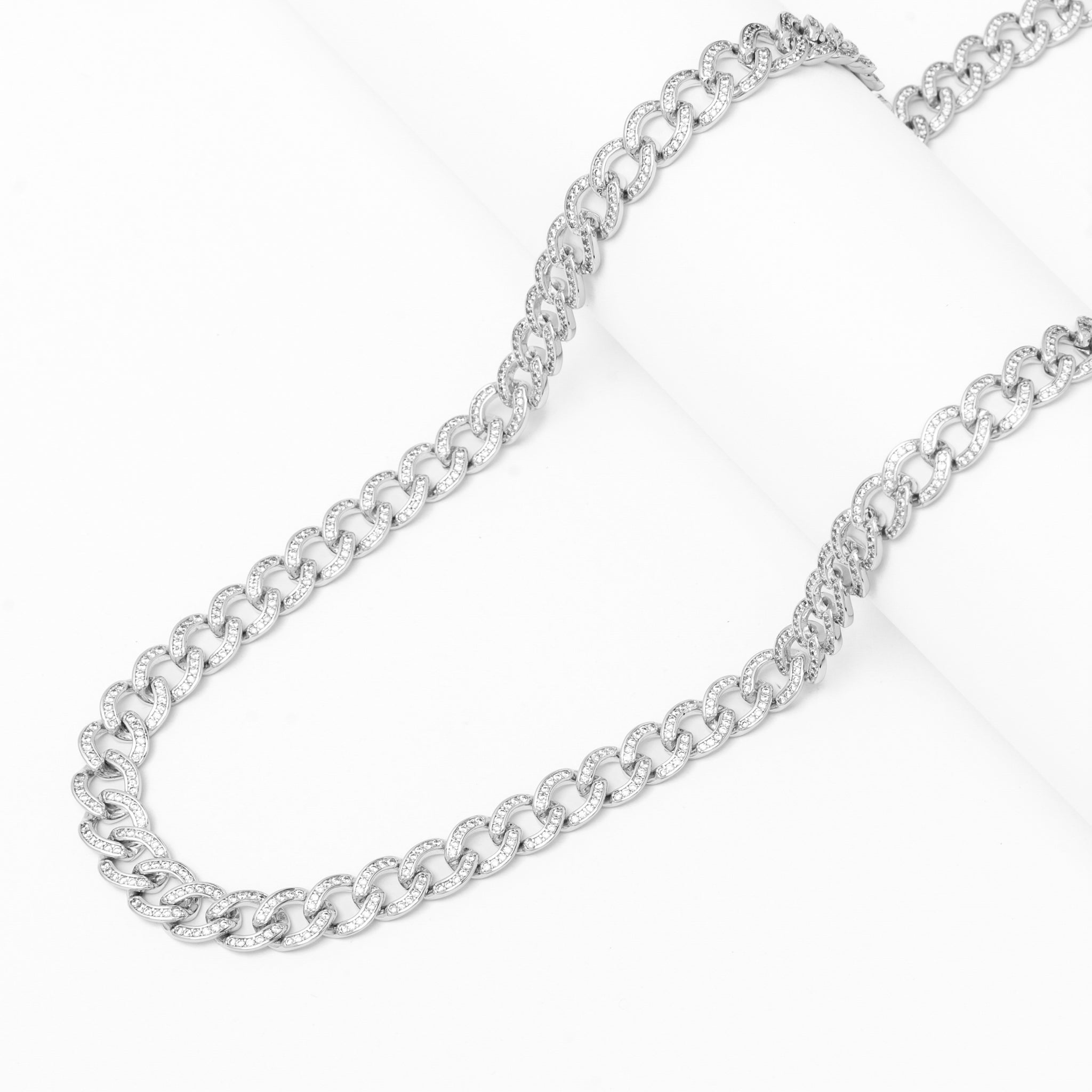 Close-up of 8MM iced curb Cuban silver chain displaying link structure and sparkle detail