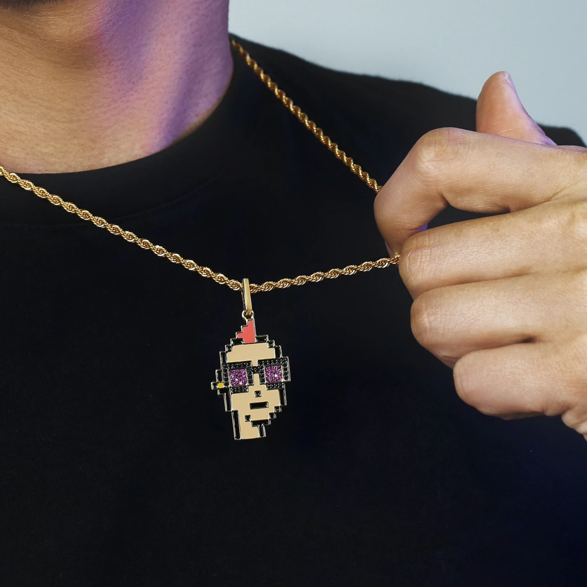 Close-up view of Big Daddy Cryptopunk pendant on gold chain, detail of sparkled design