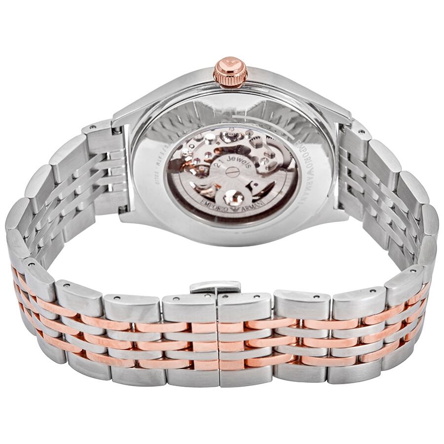 Caseback view of Emporio Armani Meccanico showing visible automatic movement and two-tone bracelet