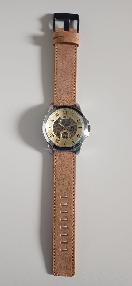 Fossil Grant watch displayed on brown leather strap with adjustable sizing holes