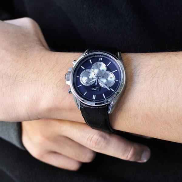 Hugo Boss chronograph watch on wrist displaying blue dial with white subdials