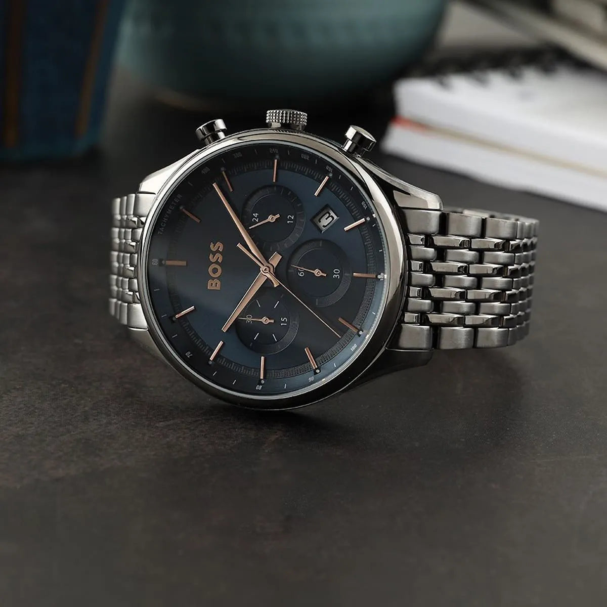 Hugo Boss Gregor chronograph watch shown from side angle on grey surface