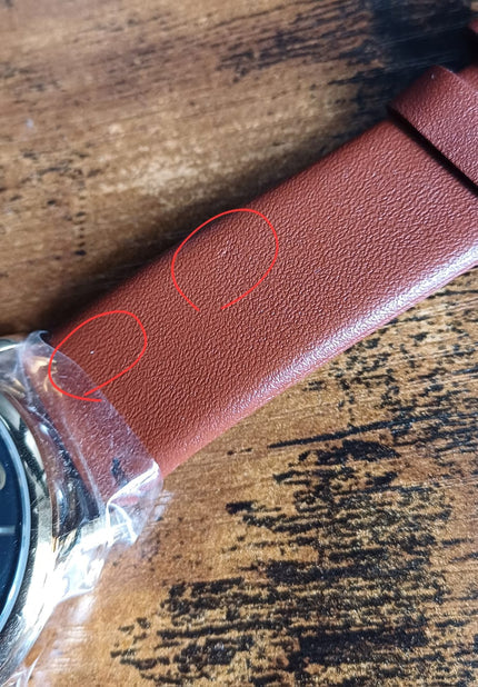 Brown leather watch strap with visible texture and stitching detail