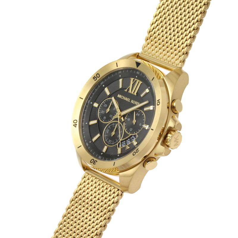 Michael Kors Brecken chronograph watch angled view showing black dial and gold-tone case