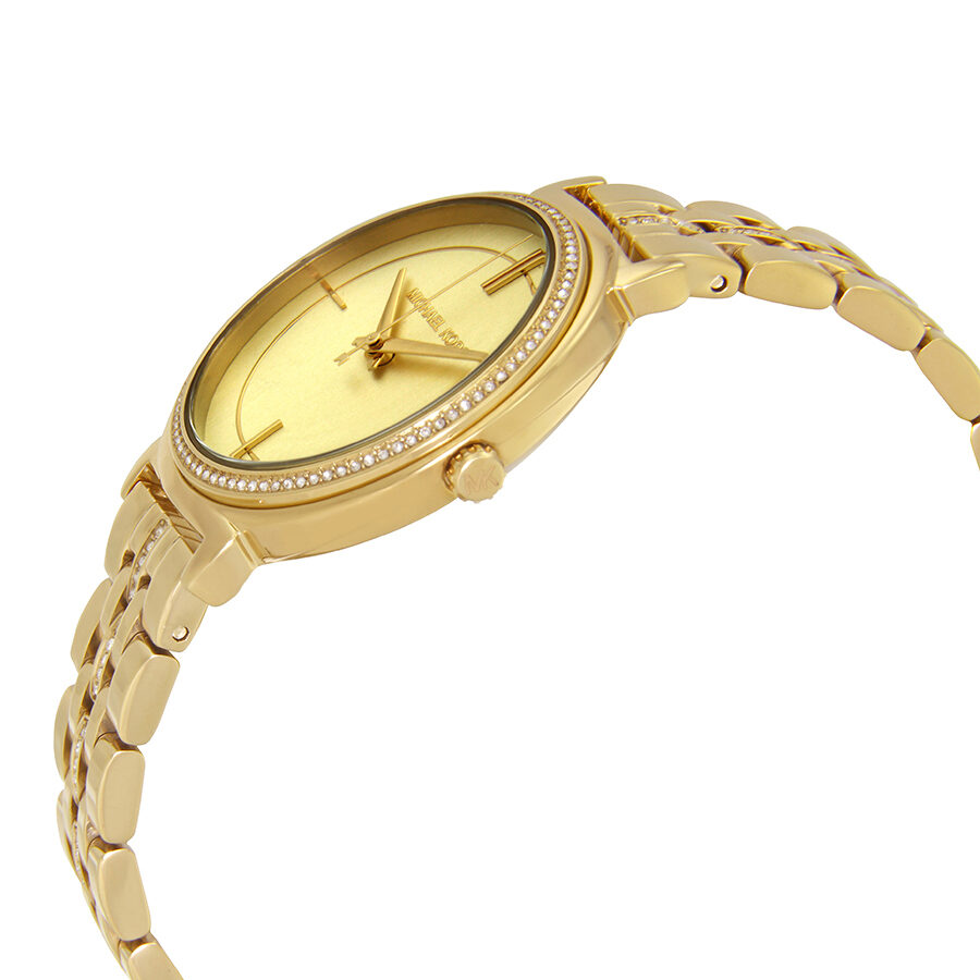 Michael Kors Cinthia watch at angle showing gold-tone case and crystal-set bezel