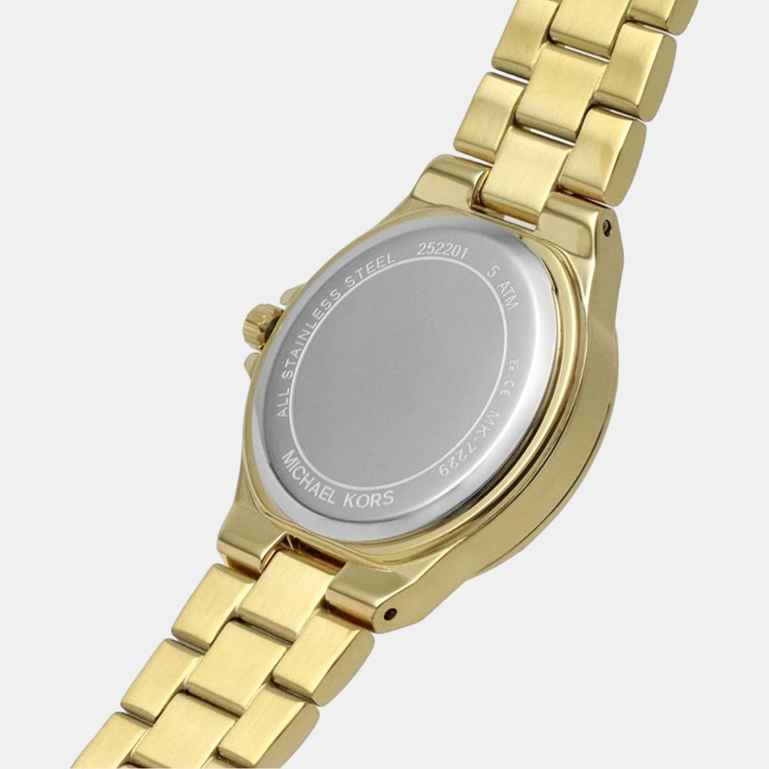 Caseback of Michael Kors Lennox watch with brand engravings and gold-tone case