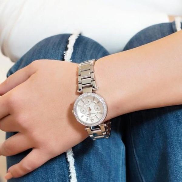 Michael Kors Parker MK5615 silver watch worn on wrist in casual styling