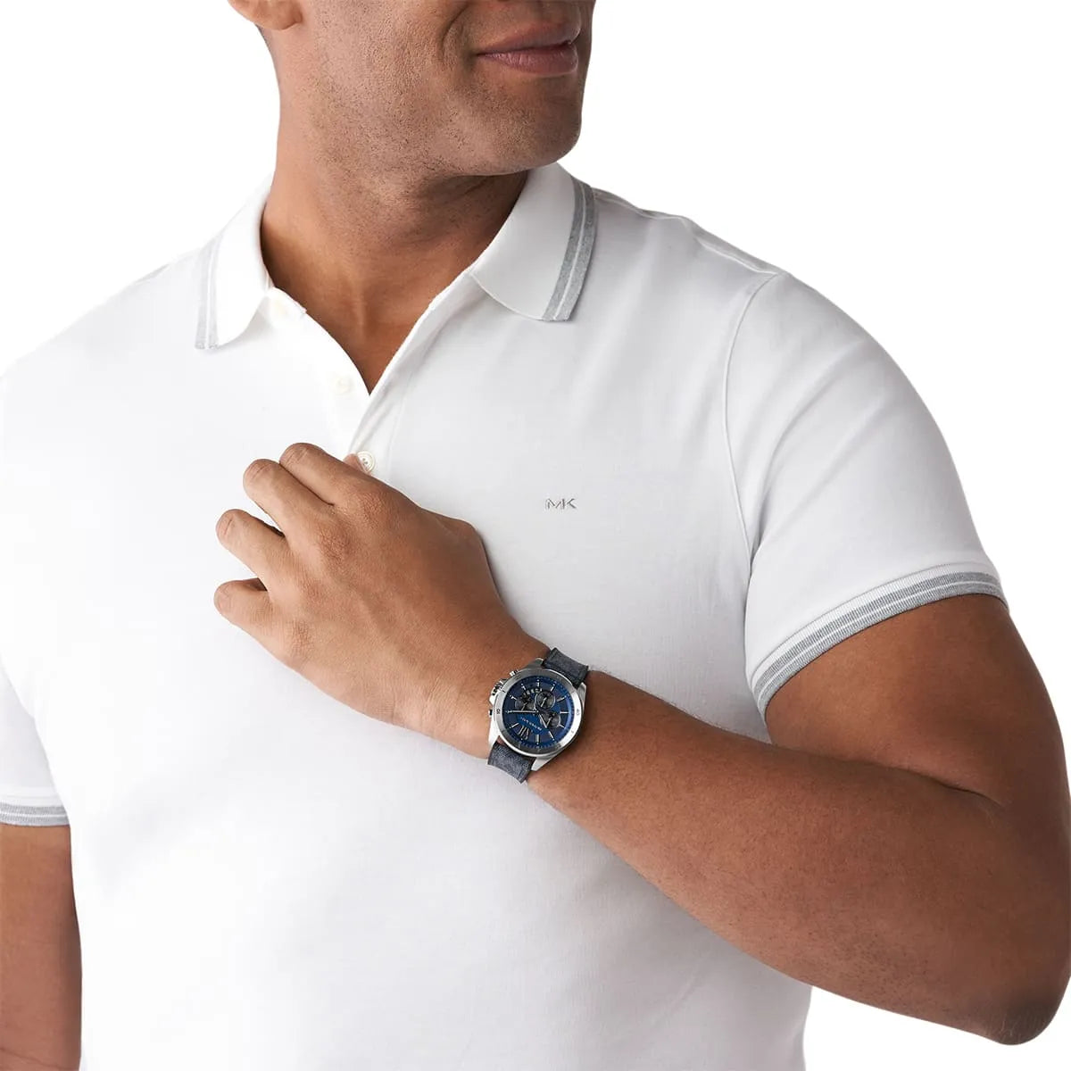 Michael Kors Brecken chronograph watch worn on wrist, showing blue dial and navy strap