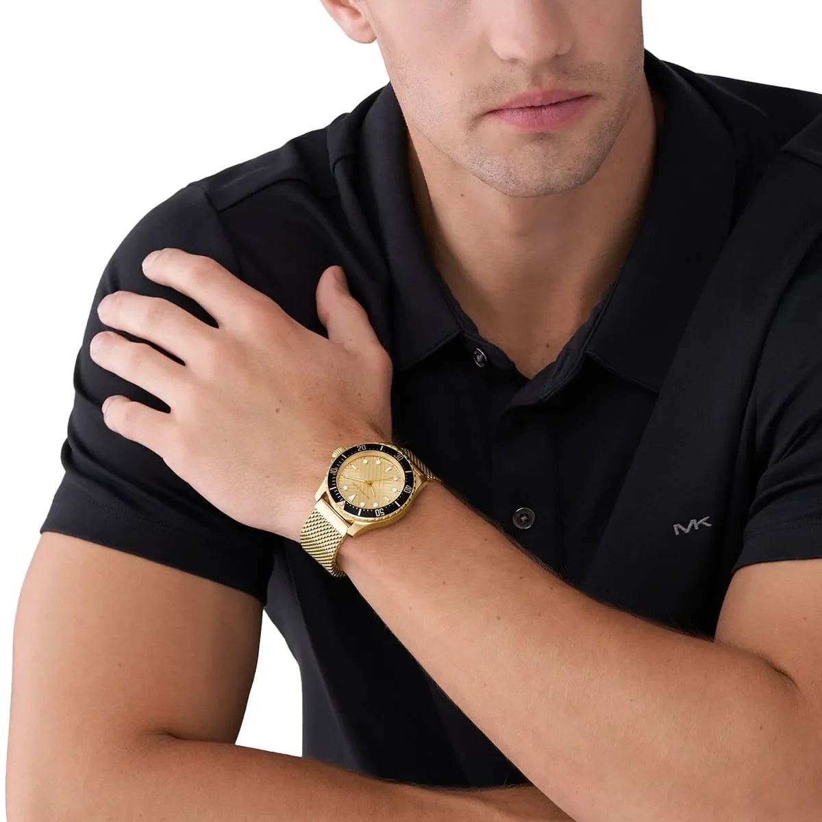 Michael Kors Everest MK9083 gold watch worn on wrist with black dress shirt