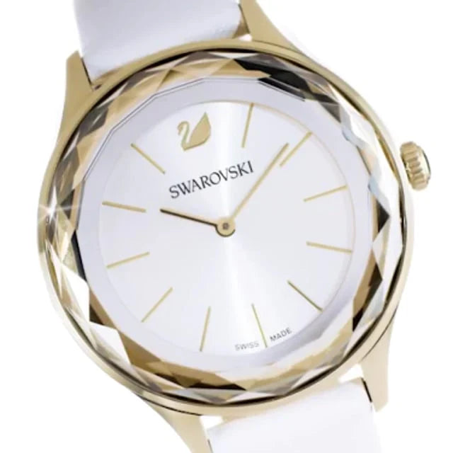 Close-up of Swarovski Octea Nova dial featuring Swarovski logo and white face with gold markers